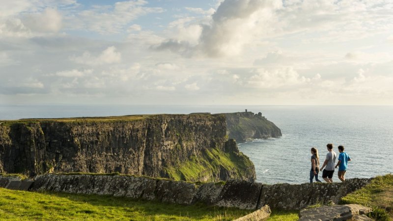 Friends walking the cliff top walk along the cliffs of moher co clare master Red Cliff Lodge